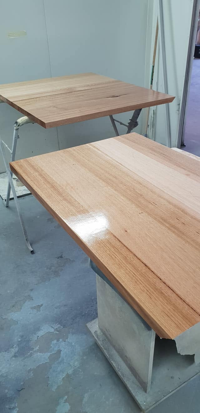 Timber tops set up on trestles between coats in the Hobart workshop