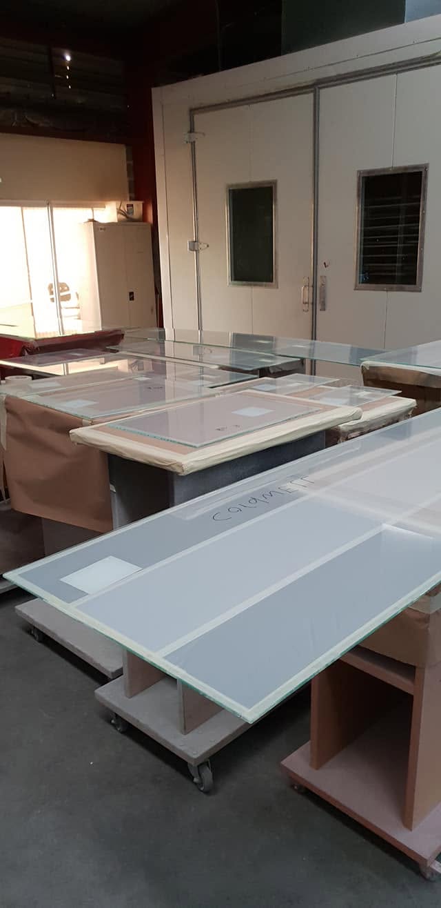 Joinery panels racked for spray finishing in the Mornington workshop