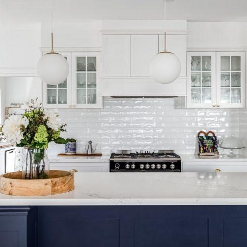 Two-tone sprayed kitchen cabinetry with a navy island in southern Tasmania