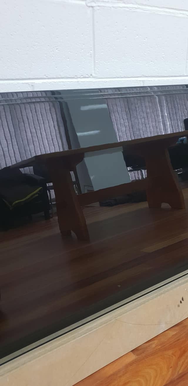 Dining table refinished in a deep timber stain with a durable topcoat
