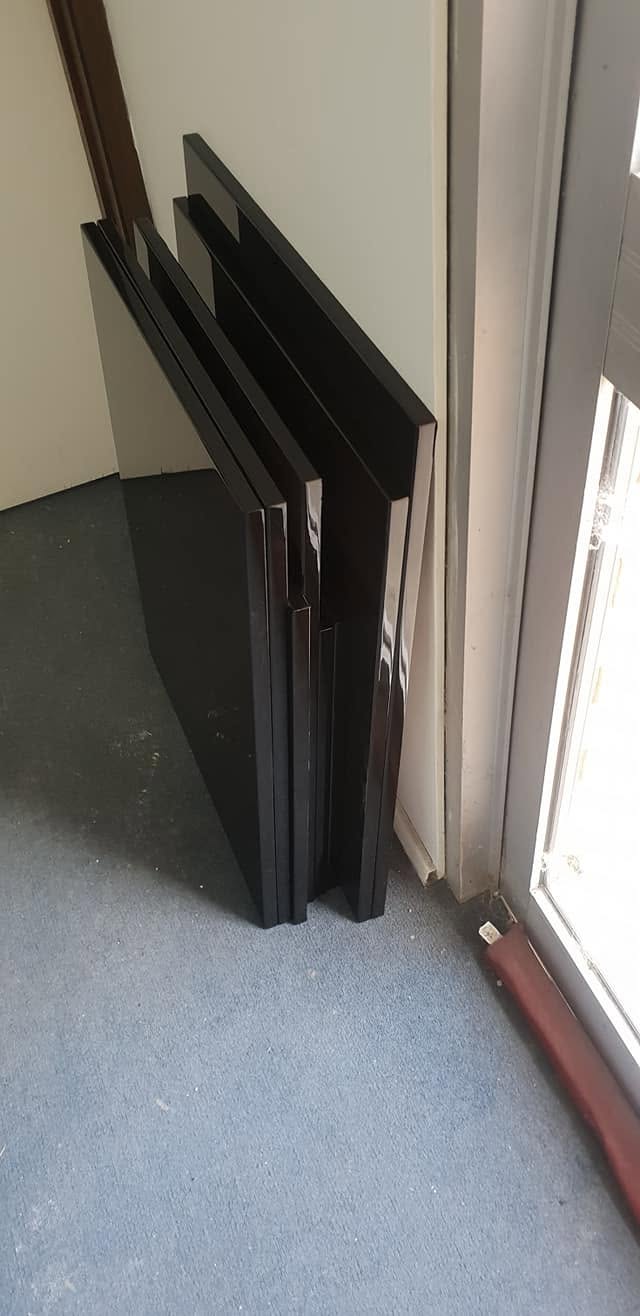 Timber doors and window frames sprayed in a dark two-pack finish