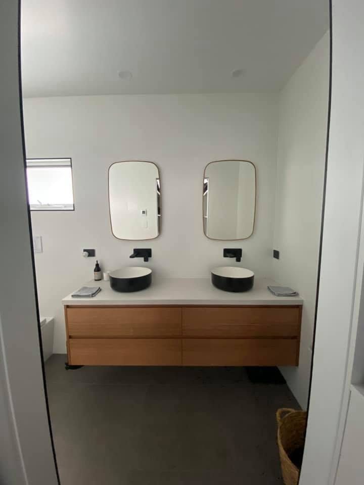 Washroom vanity joinery with twin basins, spray finished for a southern Tasmanian fitout