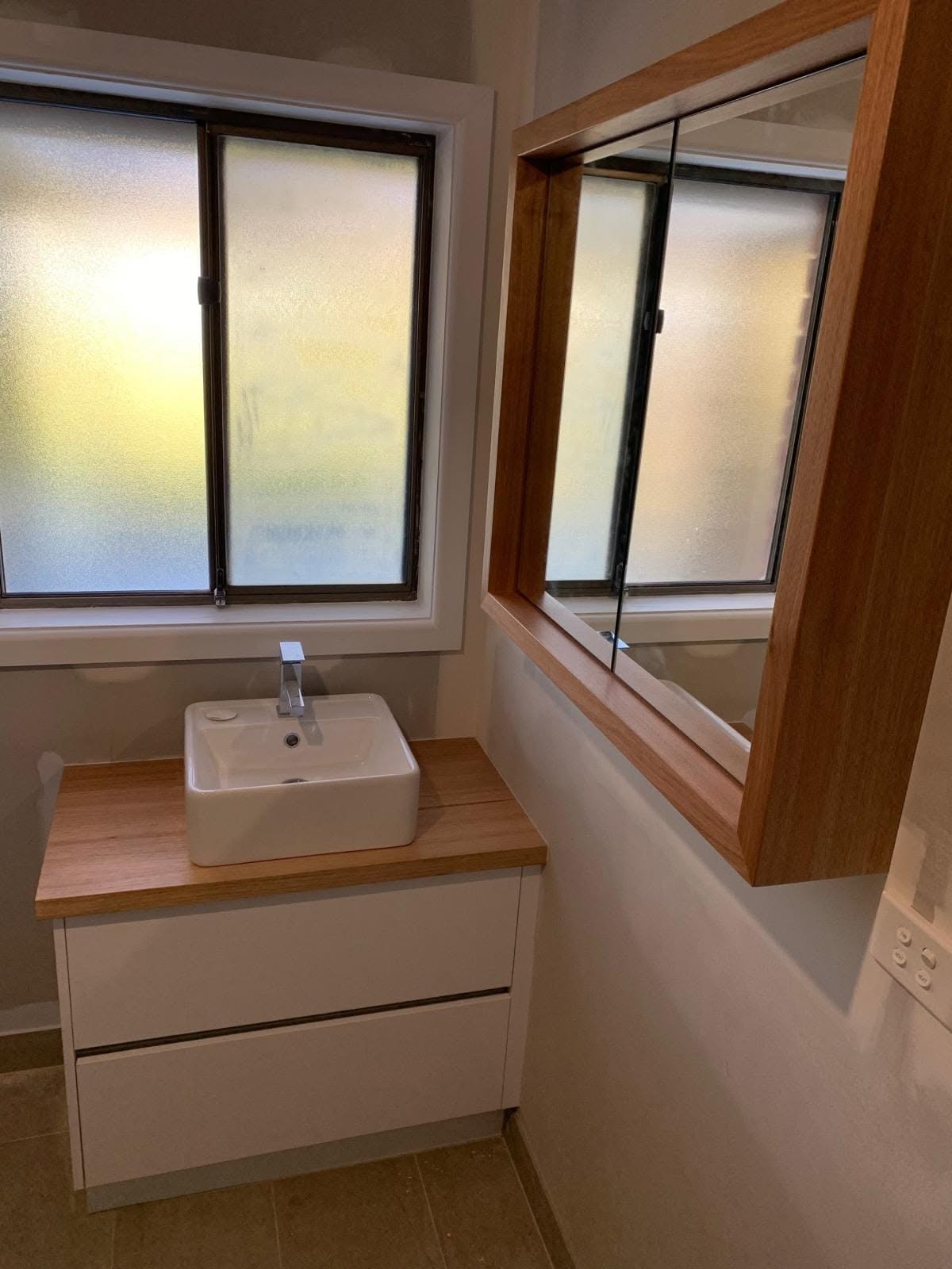 Timber window frame and vanity joinery finished in a Hobart bathroom