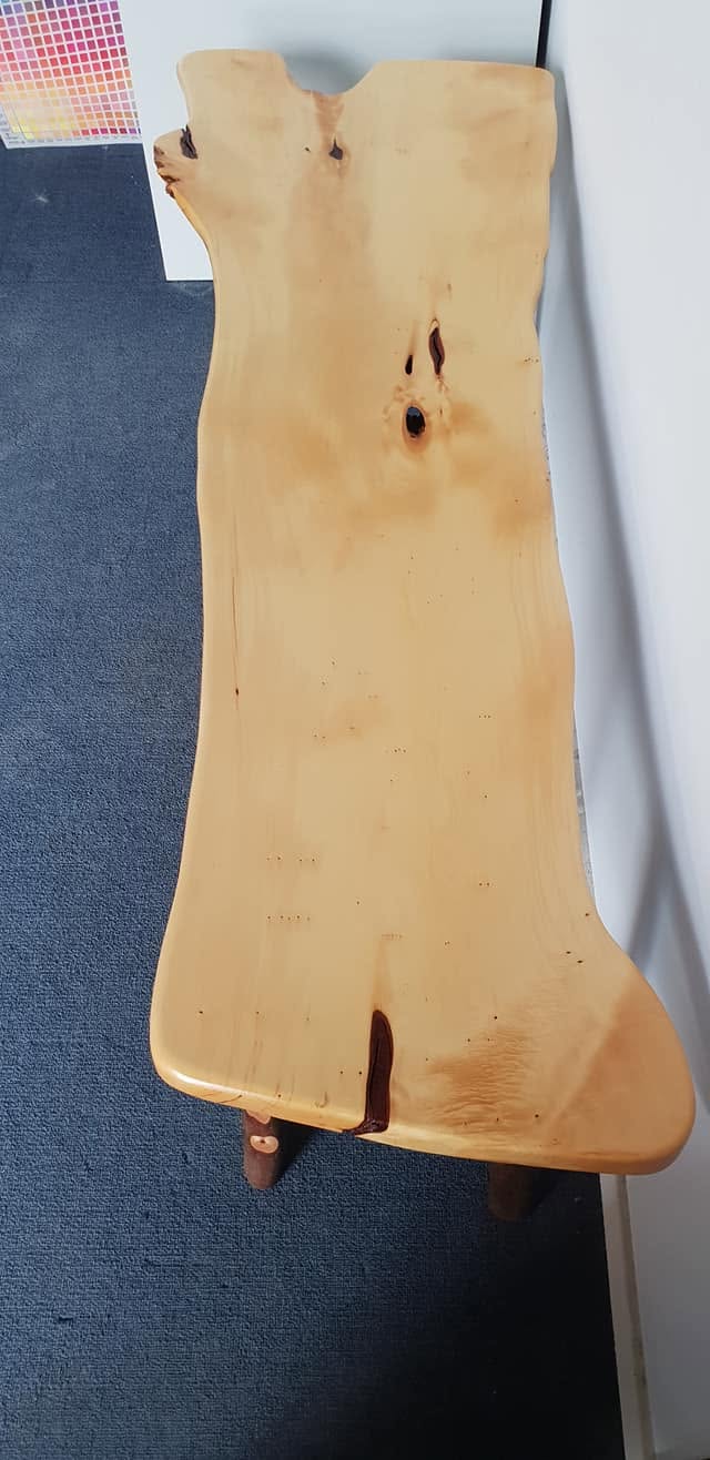 Character timber slab prepared to a uniform sanded finish in the workshop
